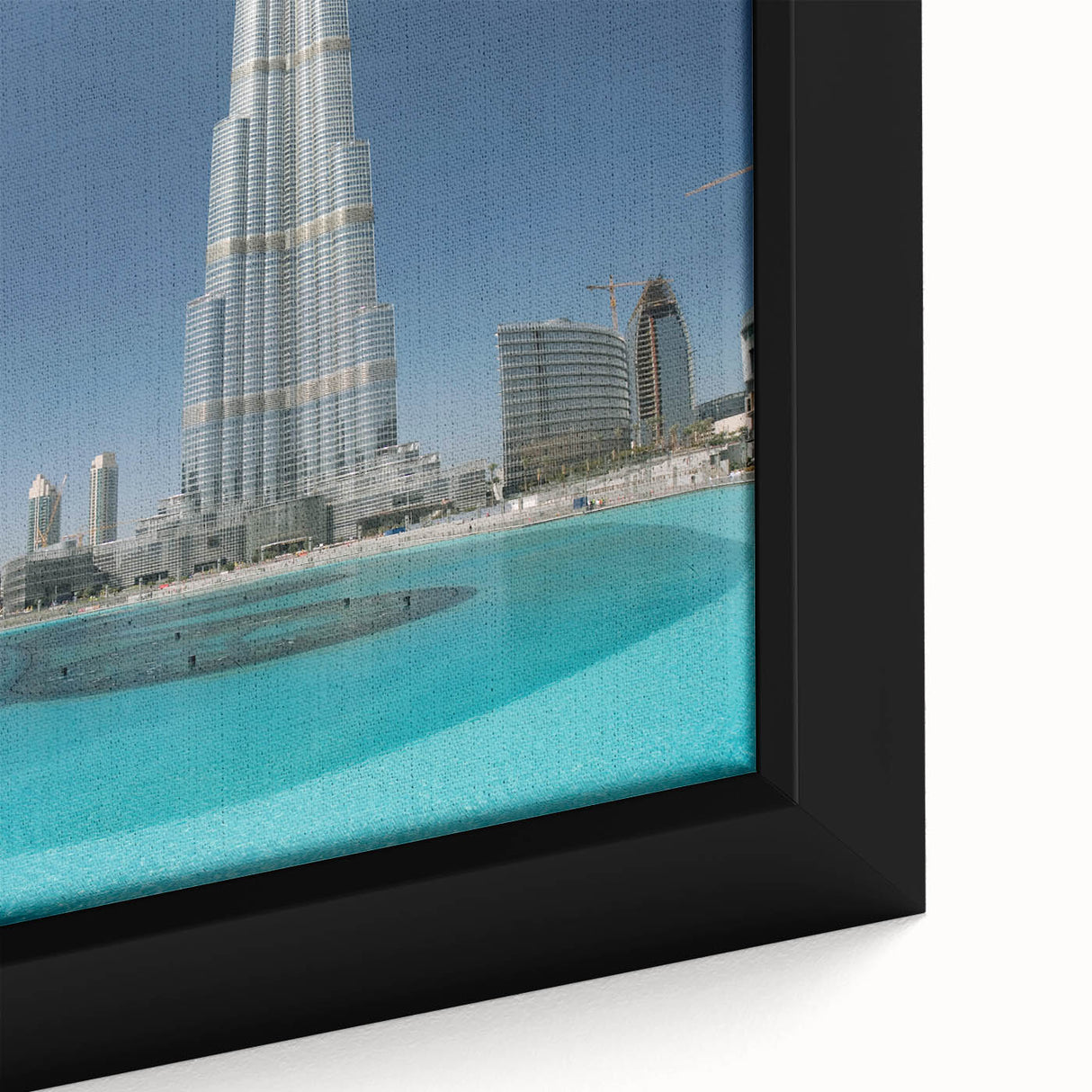 Extra large framed canvas of the Burj Khalifa in black with colorful, textured art accents, ideal for living room decor.
