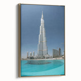 Framed canvas wall art featuring a side view of Burj Khalifa set against a golden skyline, ideal for bedroom decor.