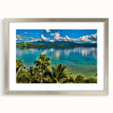 Textured abstract art print depicting a serene oceanic scene in muted blue and green hues, framed in silver.