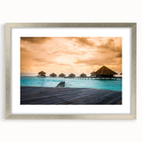 Textured abstract art print depicting a serene Bora Bora ocean scene, in muted blue and green tones, framed in silver.