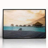 Large abstract wall art depicting the oceanic scenery of Bora Bora in muted blue and green tones, framed in black acrylic.