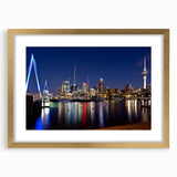 Extra large abstract art print of Auckland skyline in textured gold frame, featuring soft gray and blue tones.