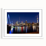 Abstract art print of Auckland skyline in muted gray and blue tones on a white framed canvas, suitable for dining room decor.