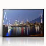 Large abstract wall art of Auckland’s skyline in muted blues and greys, framed in black acrylic.