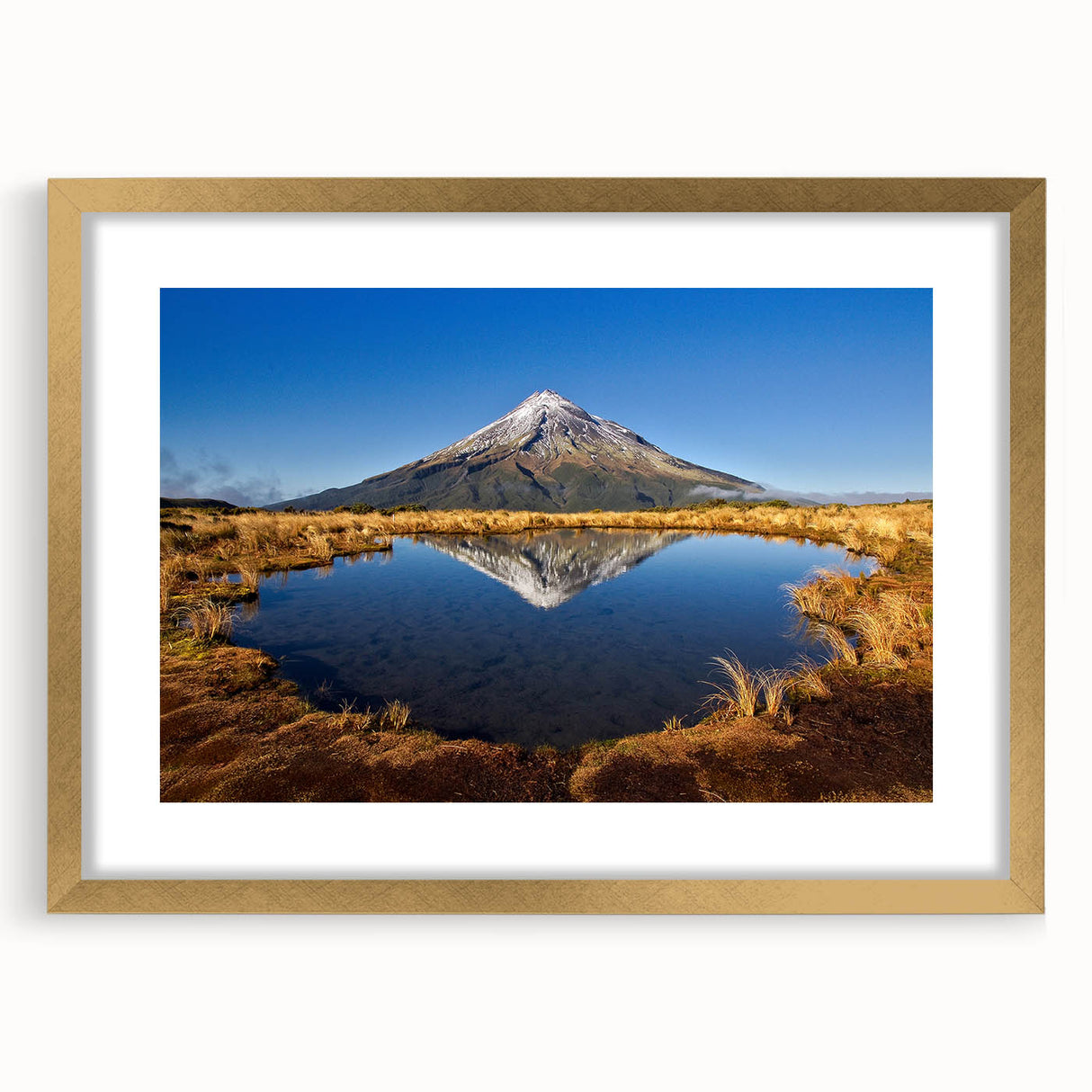 Abstract art print of Taranaki in New Zealand, featuring textured waves in muted blue and gray, framed in gold.