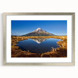 Textured abstract art print of Taranaki, New Zealand in muted earth tones on a framed canvas, ideal for bedroom decor.