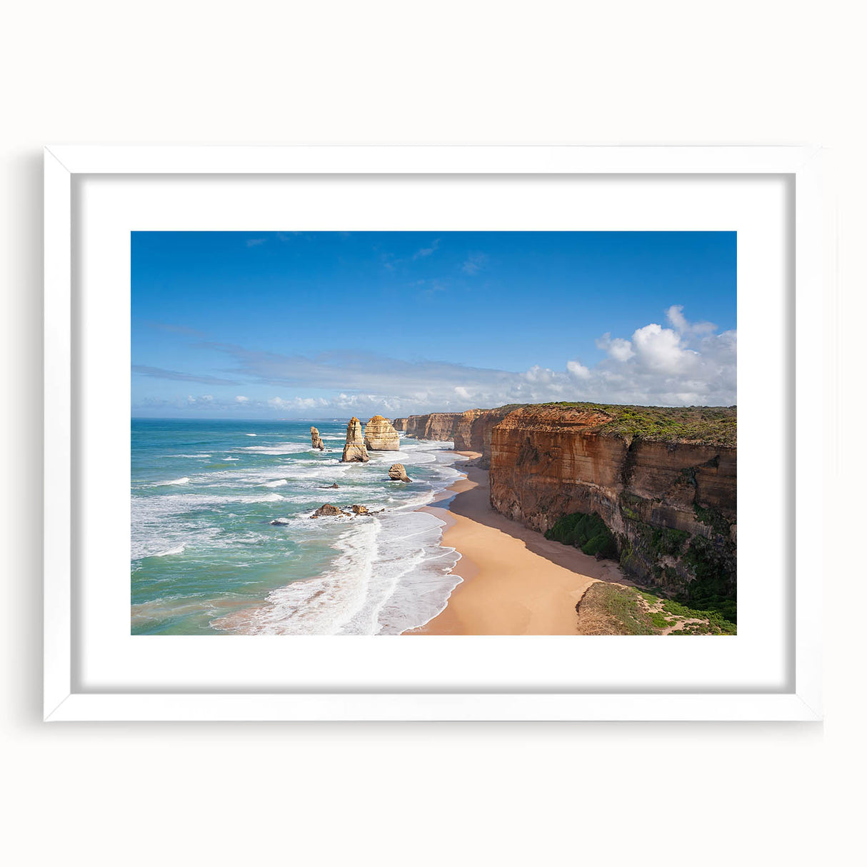 Abstract art print depicting an oceanic scene in cool blue and green tones on a white framed canvas.