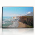 Large abstract wall art featuring oceanic hues in a mid-century modernist style, acrylic print in black frame.