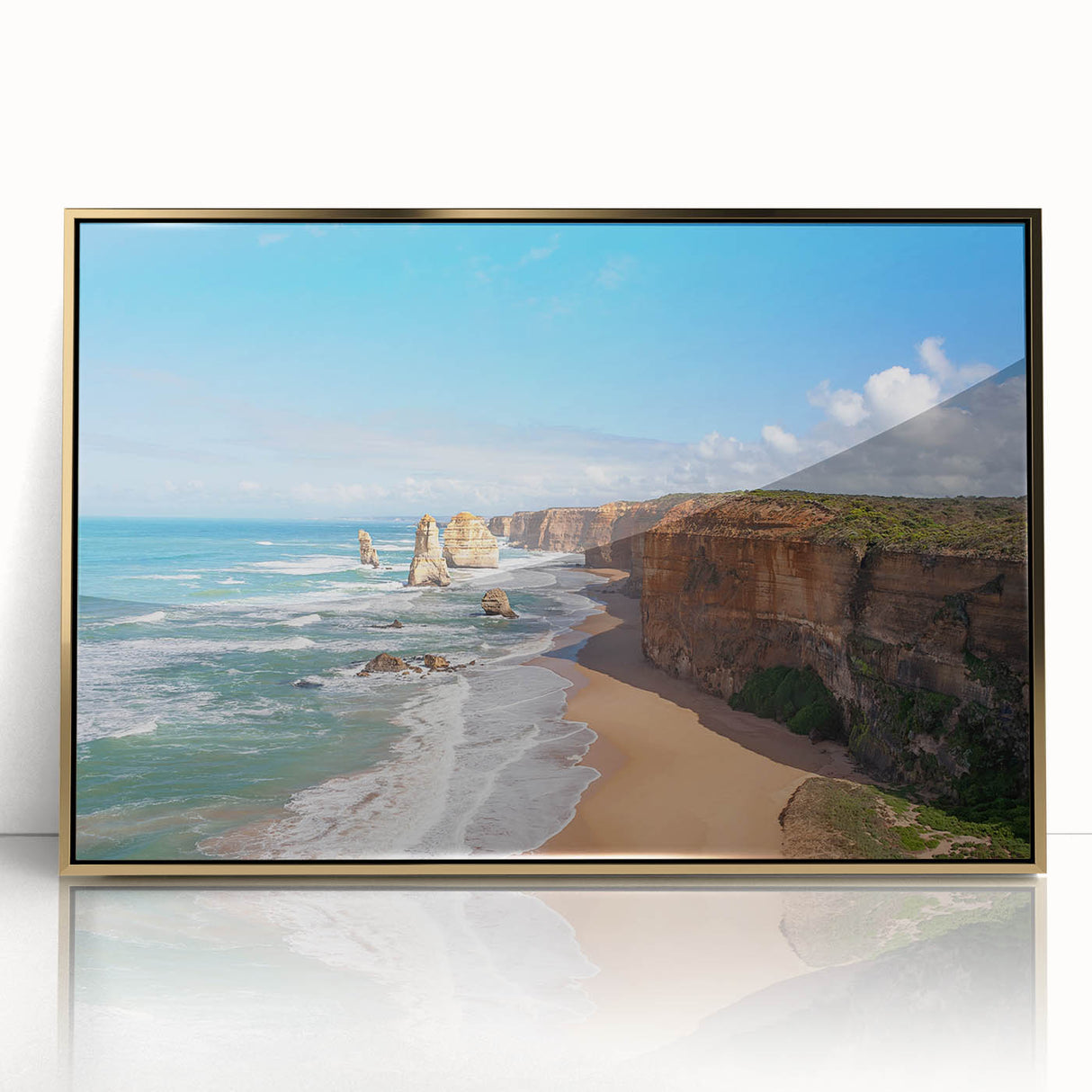 Large art print of a serene Oceania landscape in muted blue and green hues on acrylic, framed in gold.