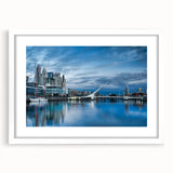 Abstract art print of Buenos Aires cityscape in muted gray and blue tones on a framed white mat, ideal for dining room decor.