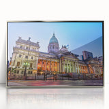 Mid-century modernist art depicting an abstract Argentinian landscape in muted earth tones on a silver-framed acrylic print.