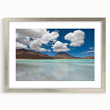Textured abstract art print of a Bolivian landscape in muted earth tones, framed in silver, ideal for bedroom decor.