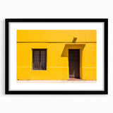 Abstract art print of Santiago skyline in vibrant colors on a large black framed canvas, ideal for living room decor.