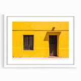 Abstract art print of Santiago skyline in muted earth tones on a framed white mat, ideal for dining room decor.