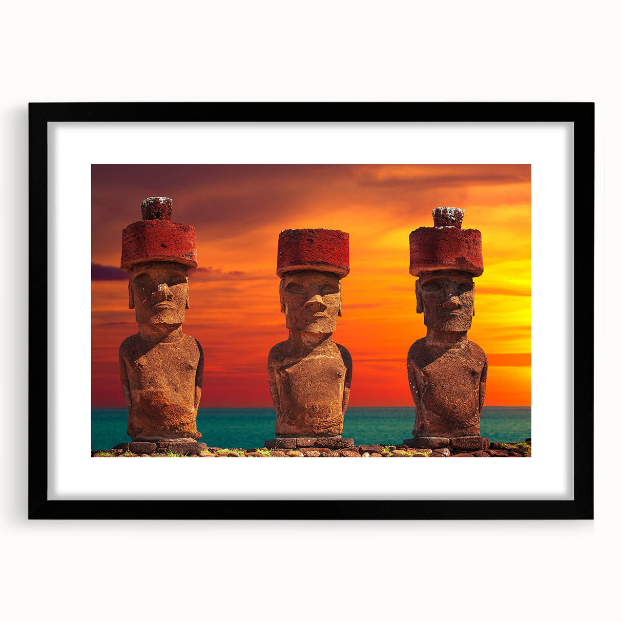 Colorful abstract art print of Easter Island scenery in vibrant hues on a large black framed canvas.