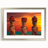 Textured art print of Easter Island statues in muted earth tones on a framed silver mat, suitable for bedroom decor.