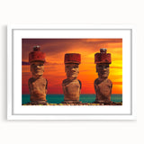 Abstract art print of Easter Island statues in muted earth tones on a framed white mat, ideal for dining room decor.