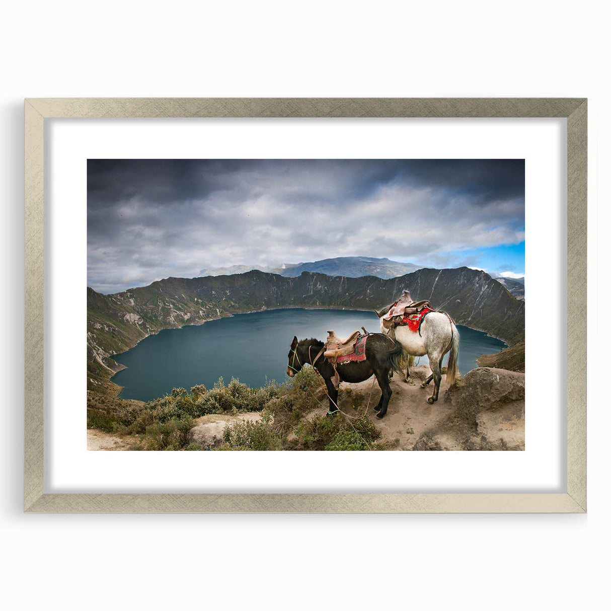 Textured abstract art print depicting a stylized South American landscape in earth tones, silver-framed with mat.