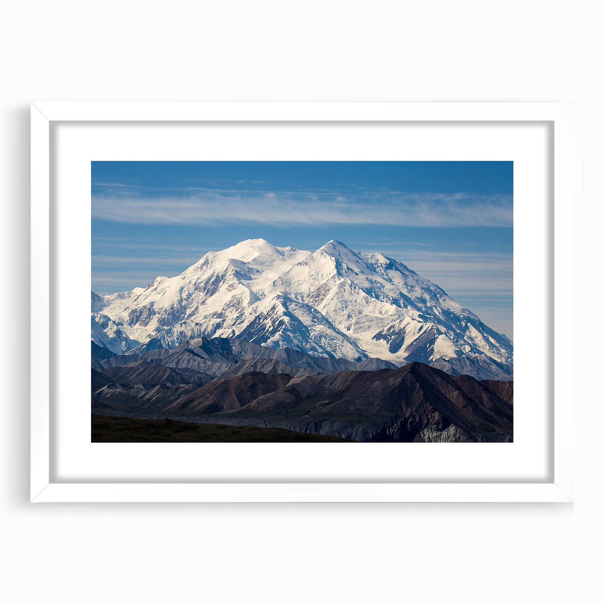 Abstract art print of Denali, Alaska in muted earth tones on a framed white mat, suitable for dining room or bedroom decor.