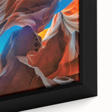 Close-up of a textured black wall art depicting Antelope Canyon in Arizona on a framed canvas.