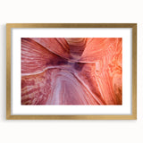 Extra large abstract art print of Arizona's Coyote Buttes in textured gold frame, with earthy hues.