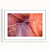 Abstract art print of Coyote Buttes in Arizona, featuring earthy orange and red tones on a white-framed mat.