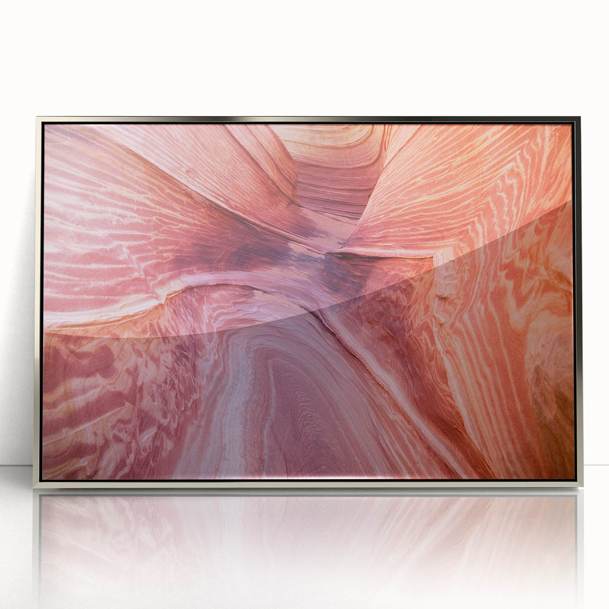 Large abstract wall art depicting Coyote Buttes in Arizona in muted earth tones, framed in silver acrylic.
