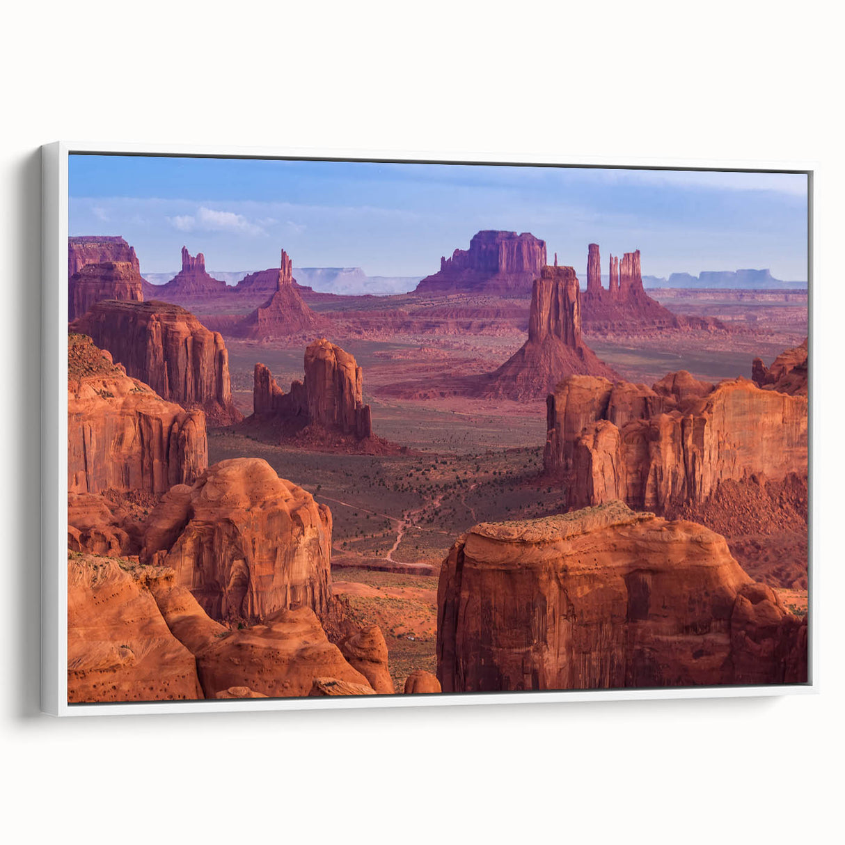 Vintage poster art of the Grand Canyon on a framed canvas, featuring vibrant earth tones, ideal for living room decor.