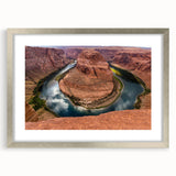 Textured art print of Horseshoe Bend in Arizona with earthy tones on a framed silver mat, suitable for bedroom art.