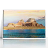 Acrylic print of Lake Powell with vivid blue and orange sunset hues, framed in white, suitable as modern art wall decor.