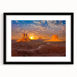 Colorful abstract art print of Monument Valley in vibrant shades on a large textured canvas, framed in black.