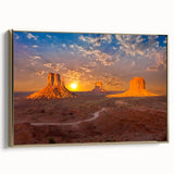 Framed canvas featuring a vintage-style landscape painting of Monument Valley in muted gold and black tones.