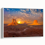 Vintage poster art of Monument Valley with vibrant red and orange tones on a white framed canvas.