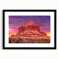 Extra large abstract art print of Sedona landscape in vivid colors on textured canvas, framed in black.