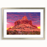 Textured art print of abstract Sedona landscape in earth tones, framed in silver, ideal for bedroom decor.