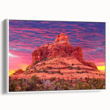 Vintage poster art of Sedona landscape, featuring vibrant red and orange hues on a white framed canvas.