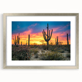 Textured abstract art print of the Sonoran Desert in muted earth tones, framed in silver, ideal for bedroom decor.