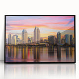 Large abstract wall art depicting the Coronado, California coastline in muted gray and blue tones, framed in black acrylic.