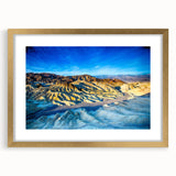 Extra large wall art featuring an abstract depiction of Death Valley in textured hues of orange and brown, framed in gold.