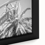 Close-up of textured black wall art featuring a colorful Hollywood, California scenery on a framed canvas.