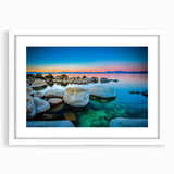 Abstract art print of Lake Tahoe with muted blue and green tones on a framed white mat, ideal for dining room decor.