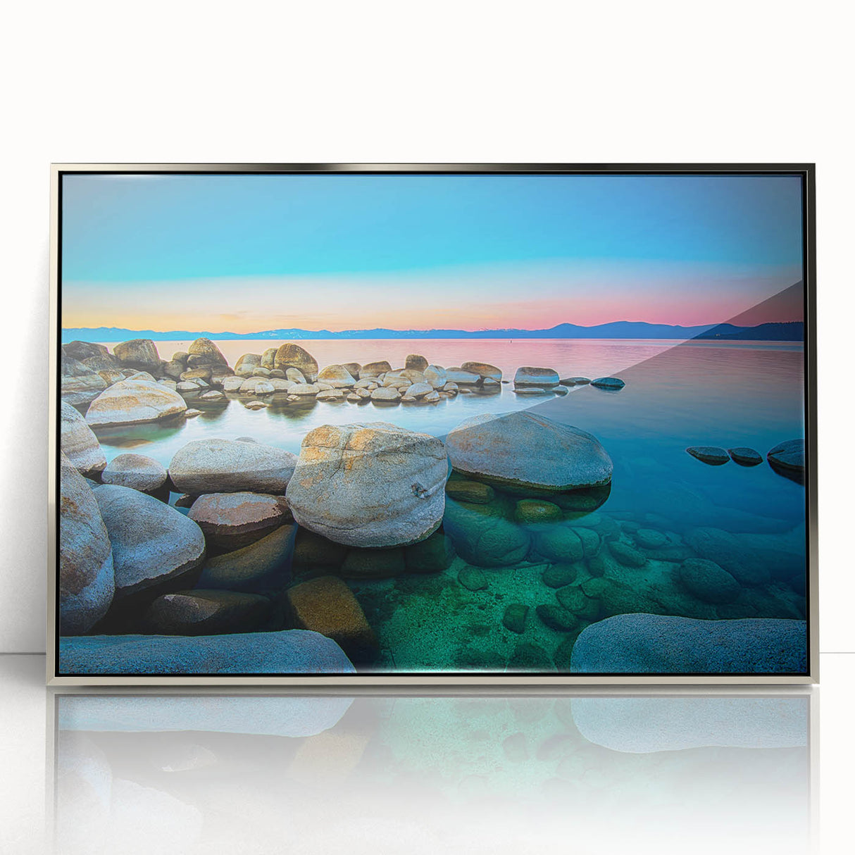 Mid-century modernist art depicting Lake Tahoe in muted blues and greens on a silver-framed acrylic print.