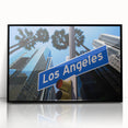 Large abstract wall art depicting the Los Angeles skyline in muted gray and blue tones, framed in black acrylic.