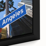 Black wall art featuring a textured Los Angeles skyline in colorful hues on a framed canvas, ideal for living room decor.