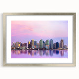 Abstract textured art print of San Diego skyline in muted gray and silver, framed with a mat, ideal for bedroom decor.