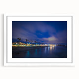 Abstract art print depicting the Santa Cruz coastline in muted blue and green tones on a framed white canvas.