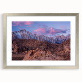 Textured abstract art print of the Sierra Nevada in muted earth tones on a framed canvas, suitable for bedroom decor.