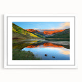 Abstract art print of Vail, Colorado in muted earth tones on a framed white mat, suitable for dining room decor.