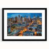 Colorful abstract art print of Denver skyline in vibrant hues on a large framed canvas, ideal for living room decor.