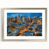 Textured abstract art print of Denver skyline in muted blue tones on a framed canvas, suitable for bedroom decor.